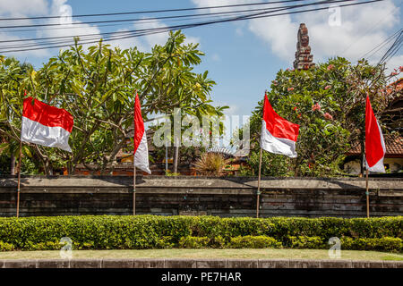 Flags at the streets of Bali before celebration on Indonesian Independence day. Bali, Indonesia Stock Photo