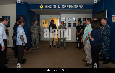 U.S. Air Force Lt. Col. Sarah Babbitt, 18th Security Forces Squadron commander, briefs Okinawa Police Station members during the Inaugural Law Enforcement Officer Exchange, Oct. 22, 2015, on Kadena Air Base, Japan. Babbitt spoke about the importance of maintaining healthy relationships with the Okinawan police to maximize the protection of island residents. (U.S. Air Force photo by Airman 1st Class Lynette M. Rolen) Stock Photo