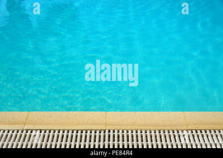 Swimming pool water surface edge background Stock Photo
