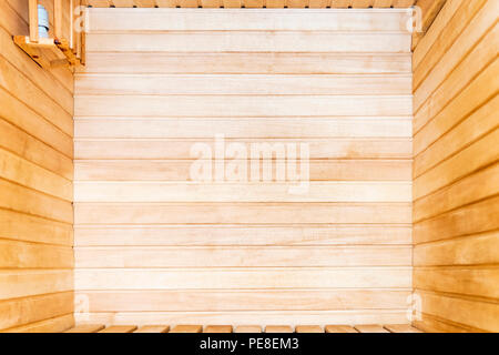 Wooden interior of the sauna from the lime strips Stock Photo