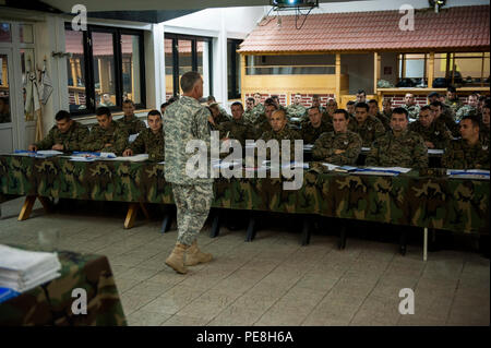U.S. Army Command Sgt. Maj. Harley Schwind, NATO Headquarters Sarajevo command senior enlisted leader, speaks to Armed Forces of Bosnia and Herzegovina soldiers about military leadership at Rajlovac Barracks, Bosnia and Herzegovina, Oct. 28, 2015. Schwind organized a group of American noncommissioned officers to give lectures on several military topics. (U.S. Air Force photo by Staff Sgt. Clayton Lenhardt/Released) Stock Photo