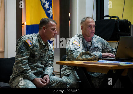 U.S. Army Sgt. 1st Class Derik Allen, National Support Element noncommissioned officer in charge of postal operations, and Command Sgt. Maj. Harley Schwind, NATO Headquarters Sarajevo command senior enlisted leader, prepare presentations at Rajlovac Barracks, Bosnia and Herzegovina, Oct. 28, 2015. A group of American NCOs were invited to lecture Armed Forces of Bosnia and Herzegovina soldiers on several military topics. (U.S. Air Force photo by Staff Sgt. Clayton Lenhardt/Released) Stock Photo