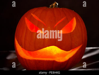 Light illuminates a jack o lantern Oct. 29 2015. Fall is the time for fun but it is important to always stay safe. Use heatless artificial lights instead of candles to light jack o lanterns. U.S