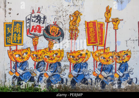 Georgetown, Penang, Malaysia - August 23, 2013: Wall artwork named 'Cats and Humans Happily Living Together' in Penang Georgetown UNESCO heritage zone Stock Photo