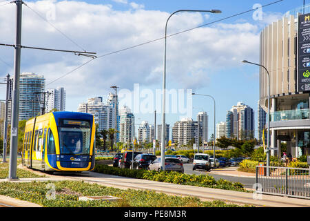 SURFERS PARADISE, AUSTRALIA - AUGUST 10,2018: A tram on the G:Link light rail system approaches Broadwater Parklands station. Stock Photo