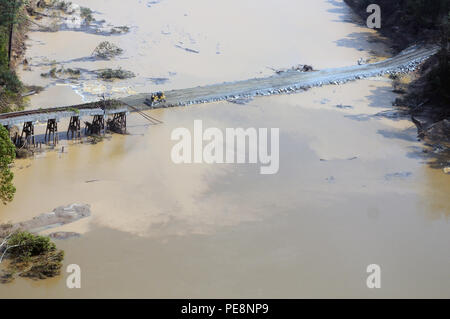 Flood damage seen during a visit by Army Gen. Frank Grass, chief, National Guard Bureau, and Air Force Chief Master Sgt. Mitchell Brush, senior enlisted adviser to the chief of the National Guard Bureau, to assess the National Guard response in support of civil authorities to severe flooding in South Carolina, Oct. 13, 2015. (U.S. Army National Guard photo by Sgt. 1st Class Jim Greenhill) (Released) Stock Photo