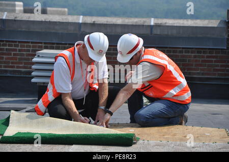 U.S. Army Corps of Engineers personnel work on a construction site at West Point, New York, performing structural assembly, infrastructure installation, safety inspections, and logistical coordination. The work supports academy housing, training, and operational readiness while ensuring compliance with engineering standards and military facility requirements. Stock Photo