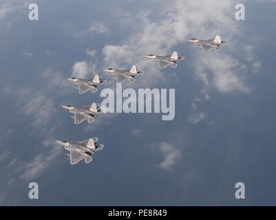 Six  F-22 Raptors from the 95th Fighter Squadron from Tyndall Air Force Base, Fla., fly over the Gulf of Mexico Nov. 5 during a local training mission.  The group of six  F-22s  were part of a large group formation of 15 Raptors. (U.S Air Force photo by Tech. Sgt. Burt Traynor/Released) Stock Photo