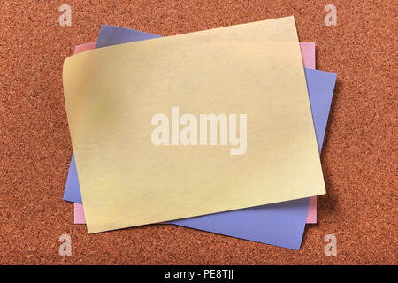 Yellow sticky post note various colors cork background Stock Photo