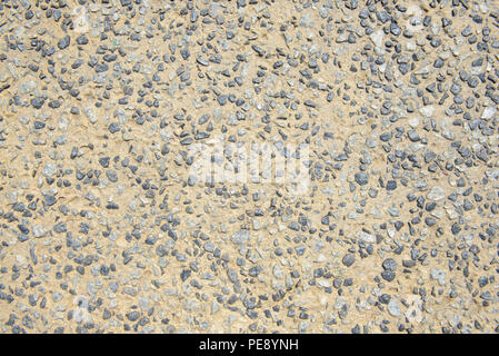 Close detailed view of a road surface constructed from crushed stone Stock Photo