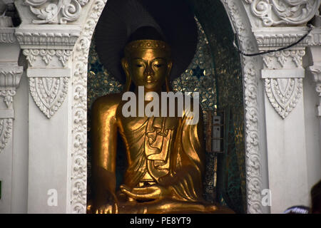 Buddha statue in Shwedagon Pagoda, Yangon, Myanmar Stock Photo