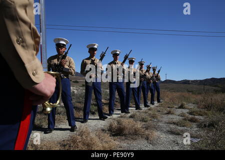 Marines from 2nd Battalion, 1st Marine Regiment, ground combat element of 13th MEU, prepare a 21-gun salute during a ceremony honoring regiment members who died in the Vietnam War. The event occurs at Camp Horno Memorial Garden, Camp Pendleton, where plaques listing the fallen are dedicated. Marines, veterans, and guests participate to recognize military service, sacrifice, and tradition, emphasizing respect and remembrance of those who gave their lives. Stock Photo