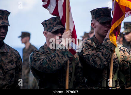 SOUTH CHINA SEA (Nov. 10, 2015) U.S. Marines with the 15th Marine Expeditionary Unit’s color guard march on the colors during a ceremony to celebrate the Marines Corps’ 240th birthday  aboard the USS Essex (LHD 2). The ceremony included a reading of Gen. John A. Lejeune’s birthday message and a cake-cutting to celebrate 240 years of tradition, service, and victory. The 15th MEU is currently deployed in the Indo-Asia-Pacific region to promote regional stability and security in the U.S. 7th Fleet area of operations. (U.S. Marine Corps photo by Cpl. Elize McKelvey/Released) Stock Photo