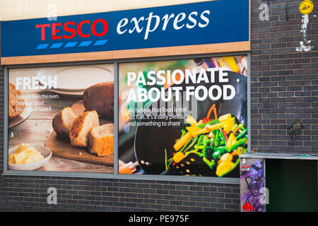 Tesco Express at North Street, Bedminster, Bristol on a wet rainy day  in August - passionate about food Stock Photo