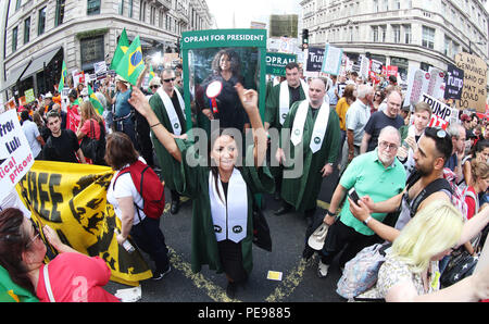 A large gospel choir brings the noise to the anti-Trump protest, delivering a potential saviour in the shape of Oprah Winfrey, as Paddy Power slash the talk show host's Presidential odds to 20/1. 'Oprahtic' were in full voice as they wheeled a lifelike waxwork of Winfrey through the march, following a survey in which 71% of Brits said they would like her to run.  Featuring: Atmosphere Where: London, United Kingdom When: 13 Jul 2018 Credit: Joe Pepler/PinPep/WENN.com Stock Photo