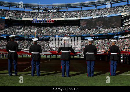 File:Service members unfurl flag at NY Jets first home game at new