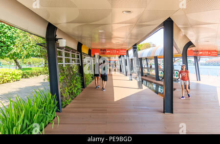 Singapore - July 13, 2018: People On The Sentosa Boardwalk Foot Bridge Stock Photo