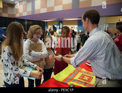 John Nevels, a structural engineer with the U.S. Army Corps of Engineers Engineering and Support Center in Huntsville, demonstrates a primary fragment from a previous blast to fifth-grade students at Mill Creek Elementary School during a STEAM educational event. The session introduces students to principles of engineering, structural integrity, mechanical concepts, and safety awareness, connecting science, technology, engineering, arts, and mathematics in a hands-on learning environment. Stock Photo