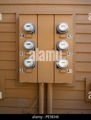 Electricity meters outside an apartment complex Stock Photo