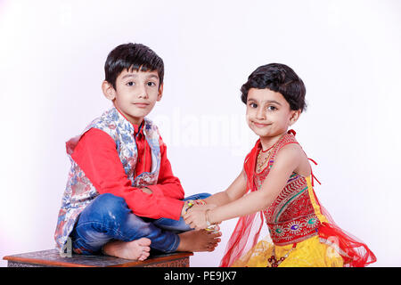 cute Indian brother and sister celebrating raksha bandhan festival Stock Photo