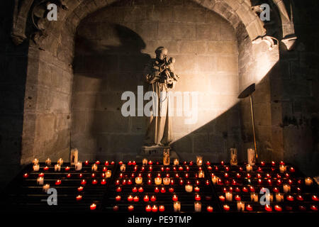 Altar with candles in the Basilica of Saint Nazarius and Celsius in Carcassonne, France. Horizontal shot. Stock Photo