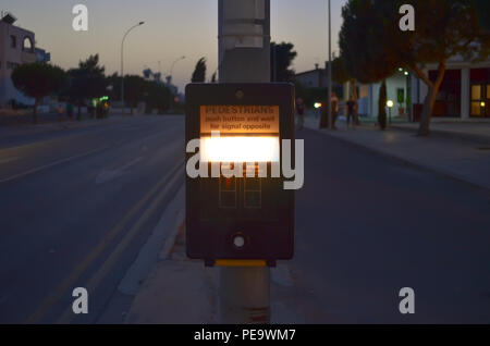 Crosswalk button for pedestrian in evening. Push this button to cross. Stock Photo
