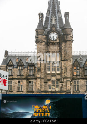 Robert McAlpine construction works at old Royal Infirmary Edinburgh with Gothic clock tower, soon to be Edinburgh Futures Institute, Scotland, UK Stock Photo