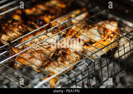 fish barbecue, the process of cooking fish on the grill, picnic food Stock Photo