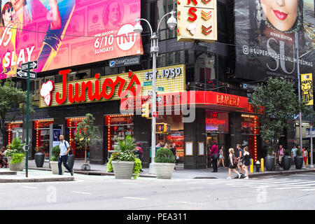 NEW YORK CITY - JULY 26, 2018: View of Times Square in Manhattan with the famous Junior's Restaurant on the corner and people in view. Stock Photo