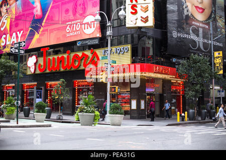 NEW YORK CITY - JULY 26, 2018: View of Times Square in Manhattan with the famous Junior's Restaurant on the corner and people in view. Stock Photo