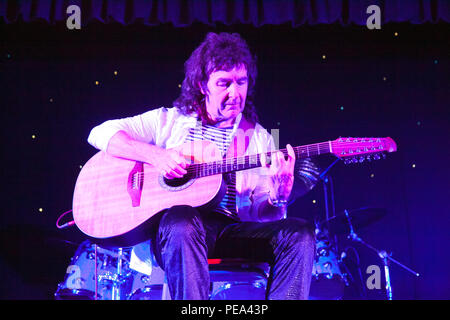 A Brian May impersonator plays on stage during a Queen Tribute night played by Mercury at Swillington Miners Welfare Club in Leeds Stock Photo