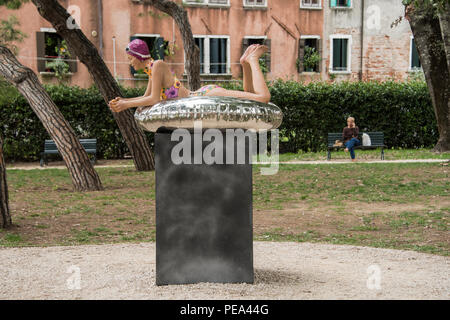 Next Summer, a hyper-realistic sculpture by Carole A Feuerman exhibited at the Venice Biennial open air exhibition in Venice, 2017 Stock Photo