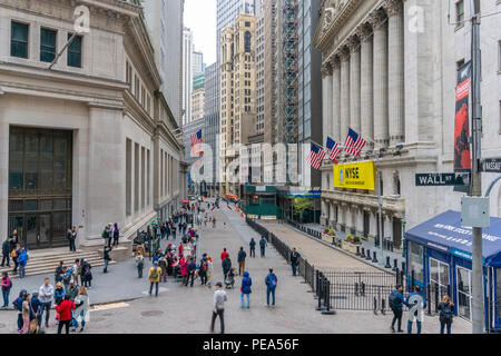 Tourists visiting the New York Stock Exchange and Wall Street in New York City Stock Photo