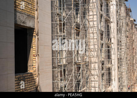 marble finishing works on the facade of a high building Stock Photo