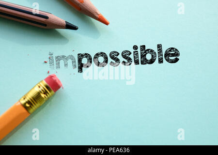Making impossible in to possible by eraser Stock Photo