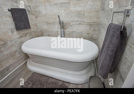 Interior design of a luxury show home bathroom with bath tub Stock Photo
