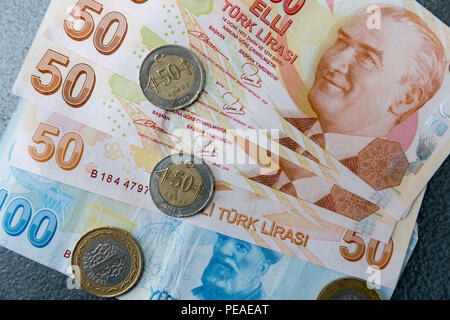 Turkish lira - Turk Lirasi - local currency coins and banknotes, featuring image of Ataturk, in Republic of Turkey Stock Photo