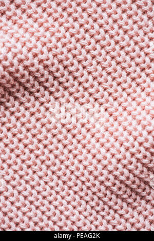 full frame image of pink knitted woolen fabric background Stock Photo