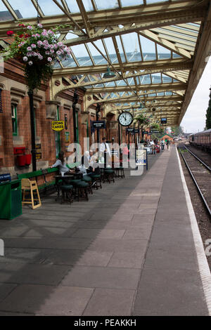 Platform One on Loughborough station heritage railway line with station master and passengers waiting for the arrival of a steam train Stock Photo