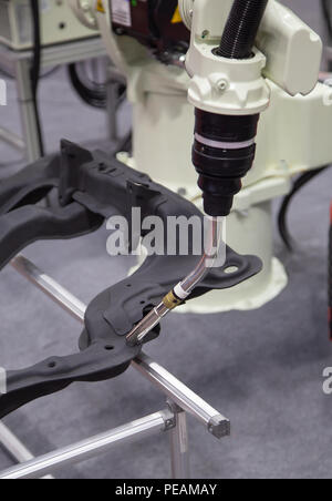Automated robotic arm welding in automotive industry Stock Photo