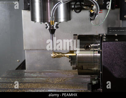 Machining football world cup trophy on milling machine Stock Photo