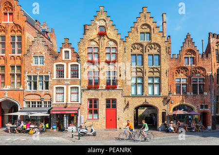 Cafes, restaurants and shops on Academiestraat near Het Tolhuis and Jan van Eyckplein, Bruges, Belgium Stock Photo