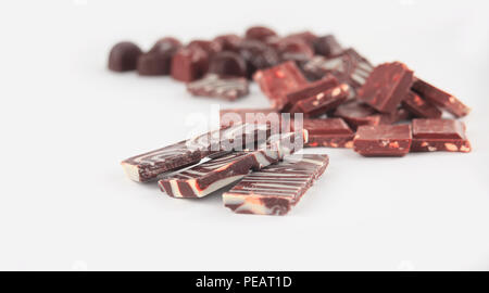 close up.a set of chocolate bars and sweets. isolated on white.p Stock Photo