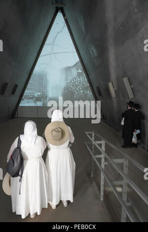 Two nuns and two traditionally dressed Jews at the Yad Vashem Holocaust Museum in west Jerusalem. From a series of travel photos taken in Jerusalem an Stock Photo