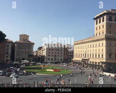 Rome, Rome, China. 14th Aug, 2018. Piazza Venezia is the central hub of Rome, Italy, in which several thoroughfares intersect, including the Via dei Fori Imperiali and the Via del Corso. It takes its name from the Palazzo Venezia, built by the Venetian Cardinal, Pietro Barbo (later Pope Paul II) alongside the church of Saint Mark, the patron saint of Venice. The Palazzo Venezia served as the embassy of the Republic of Venice in Rome. Credit: SIPA Asia/ZUMA Wire/Alamy Live News Stock Photo