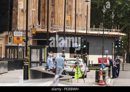 Police forensic officers outside the Houses of Parliament in London ...