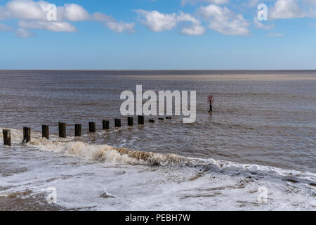 View towards the North Sea and a wave breaker in Gorleston-on-Sea, Norfolk, England, UK Stock Photo