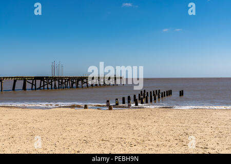 North Sea coast in Kirkley, Lowestoft, Suffolk, England, UK with the Claremont Pier and a wave breaker Stock Photo