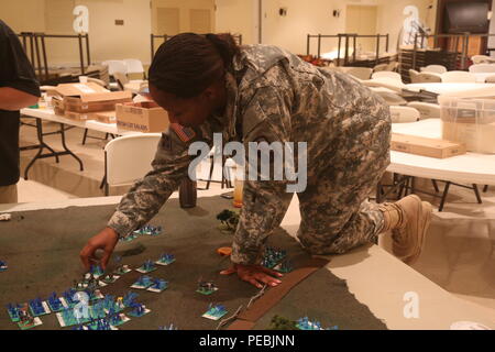 Military and civilian members of the 114th Signal Battalion meet at the Francis Scott Key Post 11 American Legion to participate in a table top exercise to re-fight the battle of Antietam, Fredericks, Md., Nov. 16, 2015. The table top exercise follows a staff ride conducted previously on the battlefield of Antietam. All members play the role of commanders during the battle to try to out maneuver the opponent armies and learn about military attack and defense strategies. (U.S. Army photo by Sgt. 1st Class Christophe D. Paul/Released) Stock Photo