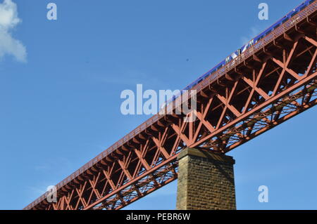 A train on the Forth Rail Bridge over the Firth of Forth connecting Edinburgh to Fife, photogrpahed from North Queensferry, Fife Stock Photo